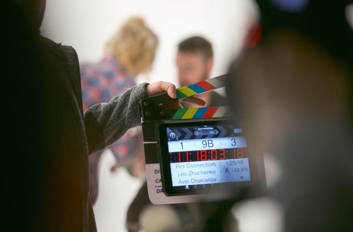 person holding clapperboard