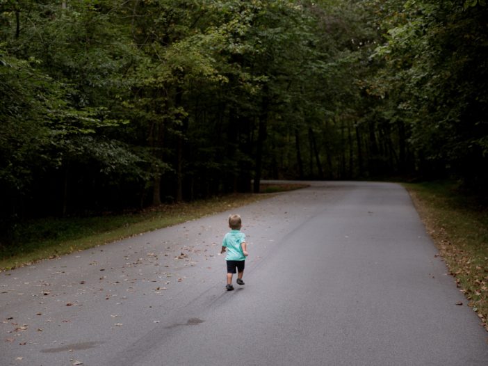 children sitting on road