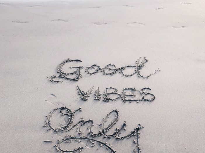 Good Vibes Only sand text