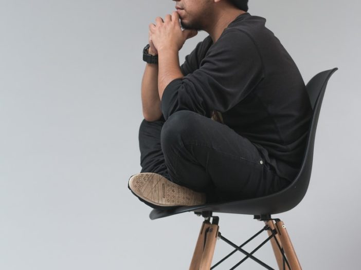 man sitting on chair