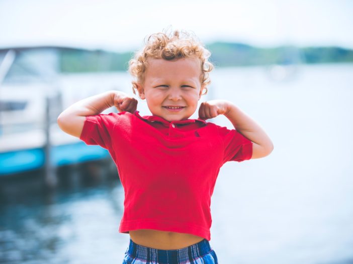 boy standing near dock